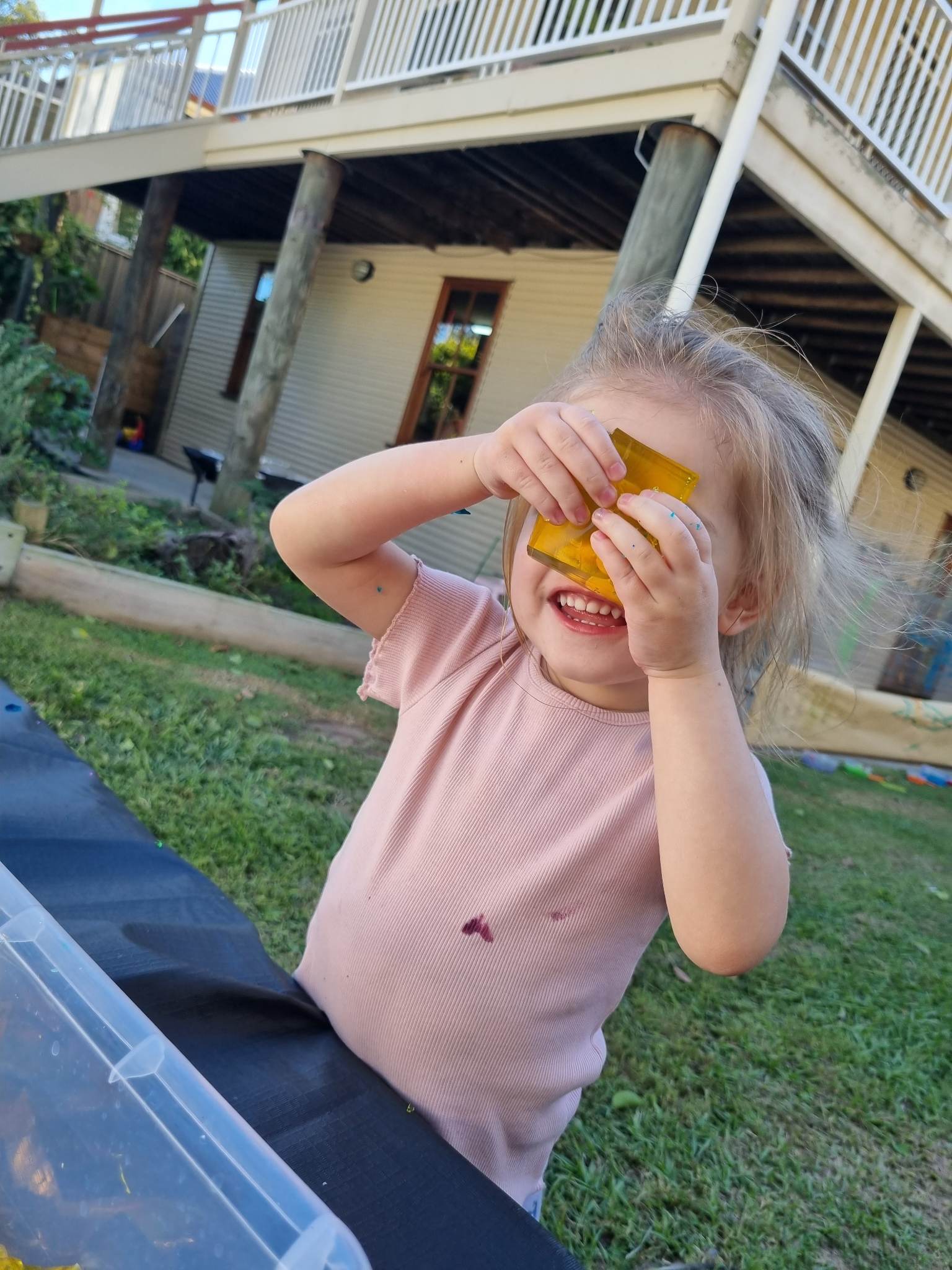 Child looking through a jelly block
